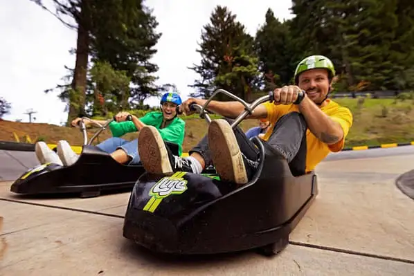 Two people riding the luge in Rotorua. 