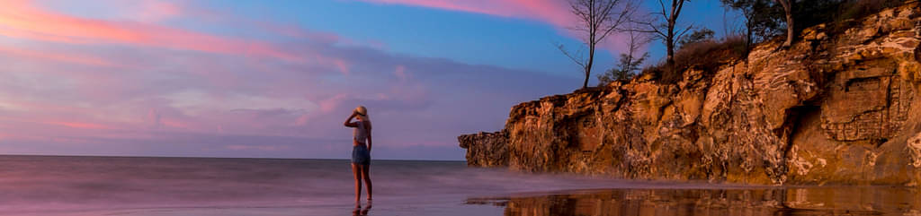 Tourist Watching Sunset At The Beach In Darwin