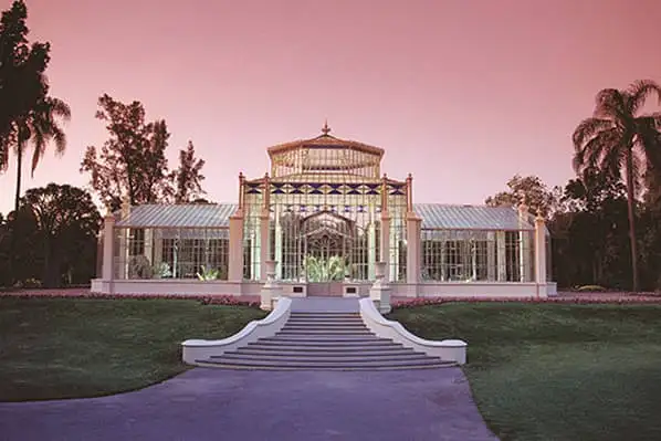 View of Palm House, an ornate glass greenhouse in Adelaide's Botanic Gardens