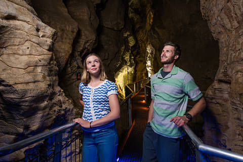Ruakuri Cave Couple looking at Formations.jpg